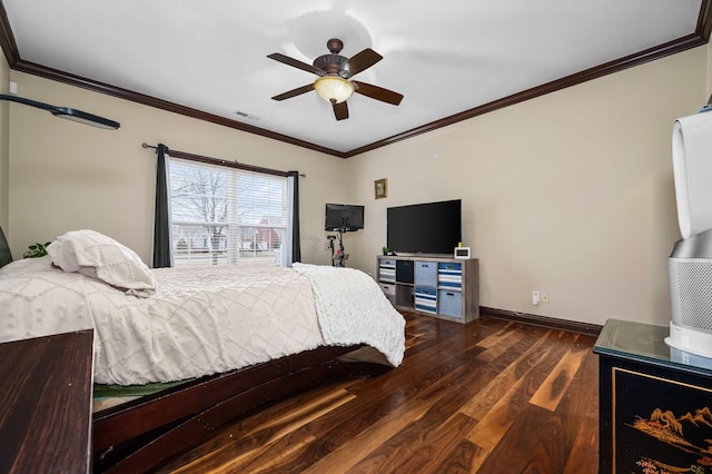 bedroom with ceiling fan, dark hardwood / wood-style flooring, and crown molding