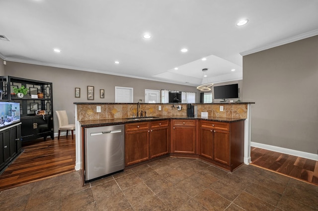 kitchen with stainless steel dishwasher, crown molding, sink, decorative light fixtures, and dark stone countertops