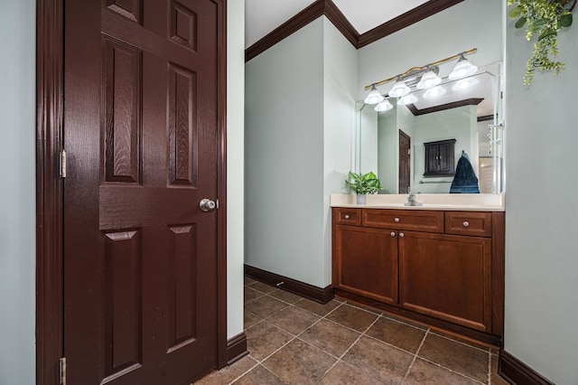 bathroom with crown molding and vanity