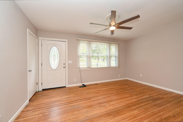 foyer with light hardwood / wood-style floors and ceiling fan