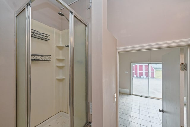 bathroom with tile patterned floors and walk in shower