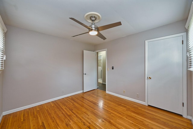 unfurnished bedroom featuring light hardwood / wood-style flooring and ceiling fan