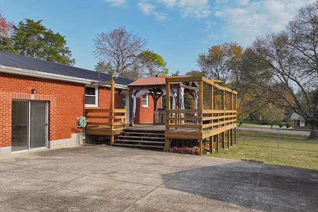 rear view of house featuring a deck