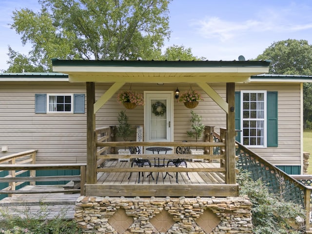 doorway to property with a wooden deck