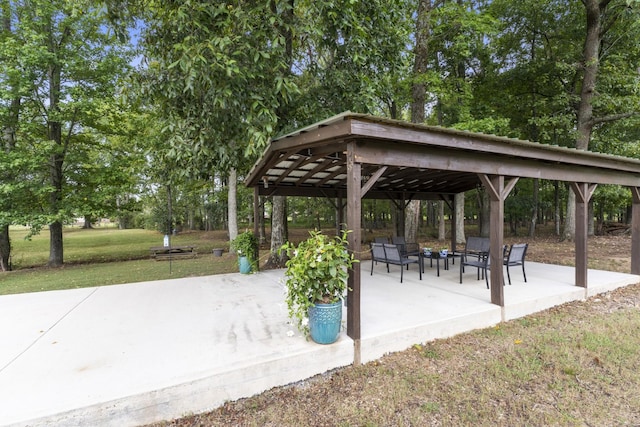 view of home's community featuring a gazebo, a patio area, and a lawn