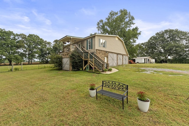 view of yard with a wooden deck and a garage