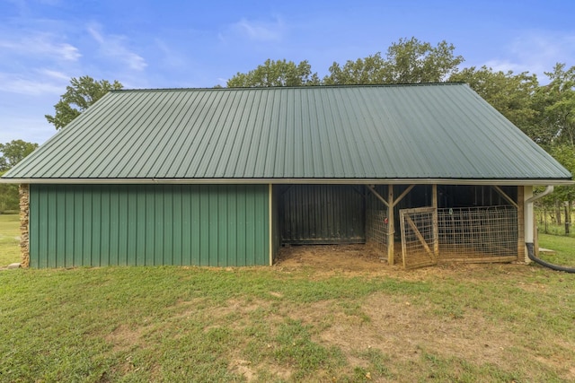 view of outbuilding with a lawn