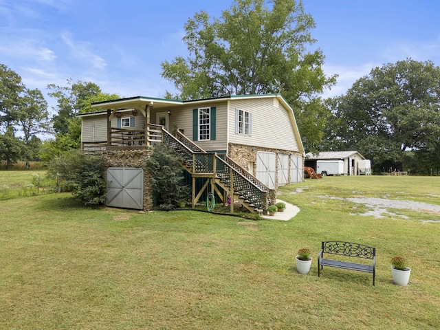 view of front of home with a front yard and a garage