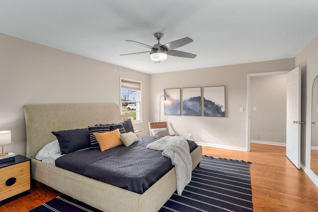 bedroom featuring hardwood / wood-style floors and ceiling fan