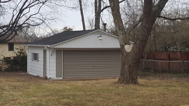 garage with a lawn