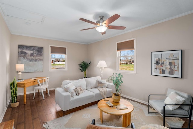 living room featuring wood-type flooring, ceiling fan, and crown molding