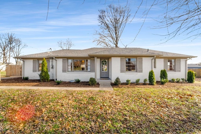 ranch-style home with a front yard