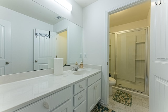 bathroom with vanity, toilet, and walk in shower