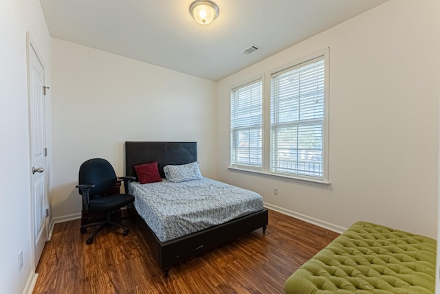 bedroom featuring dark hardwood / wood-style flooring