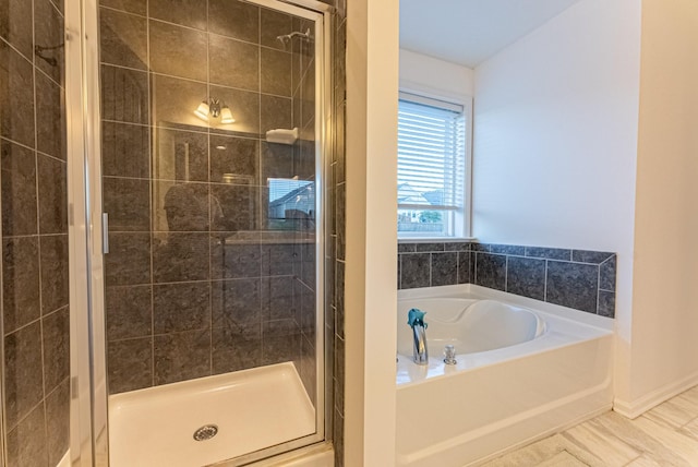 bathroom featuring tile patterned floors and independent shower and bath