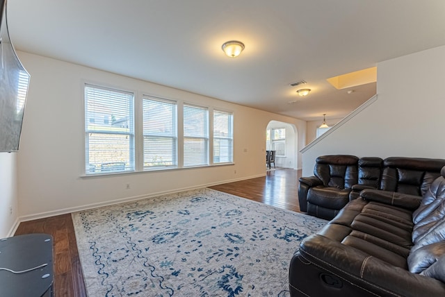 living room with dark hardwood / wood-style flooring