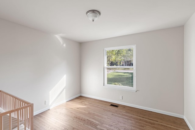 spare room featuring light hardwood / wood-style flooring