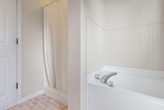 bathroom with tile patterned floors and separate shower and tub