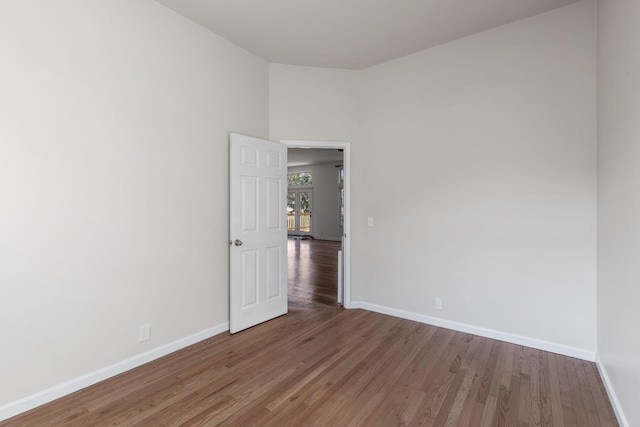 spare room with hardwood / wood-style flooring