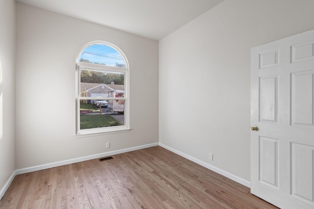 spare room with light hardwood / wood-style floors