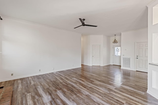 unfurnished living room featuring ornamental molding, ceiling fan with notable chandelier, and hardwood / wood-style flooring