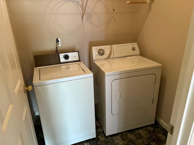 clothes washing area with washer and dryer