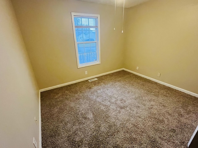 spare room with carpet floors