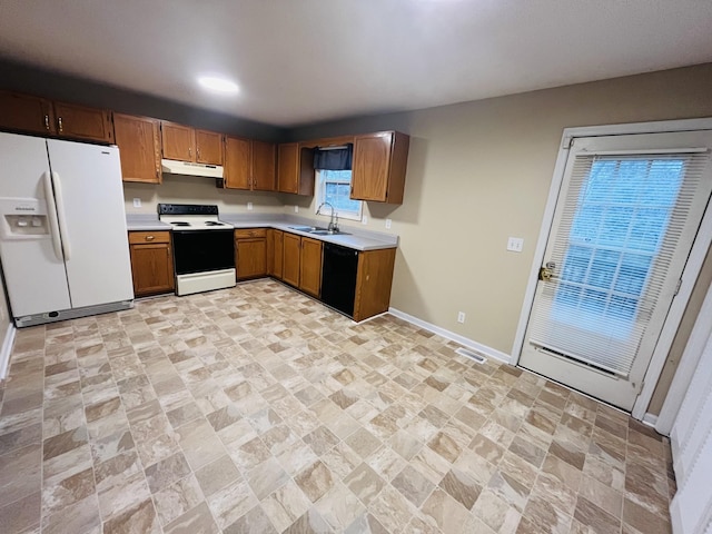 kitchen with sink and white appliances