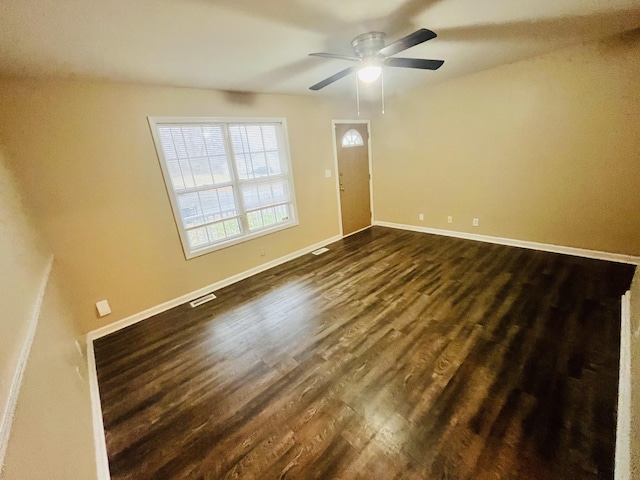 interior space featuring ceiling fan and dark wood-type flooring