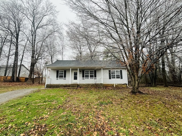 view of front of property with covered porch and a front yard