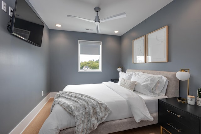 bedroom with ceiling fan and wood-type flooring