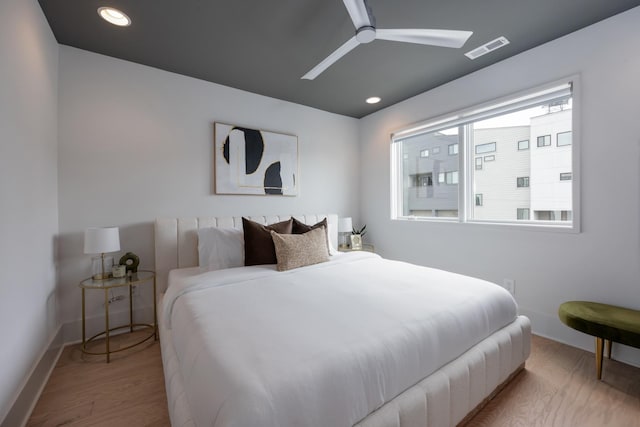 bedroom featuring ceiling fan and light hardwood / wood-style flooring