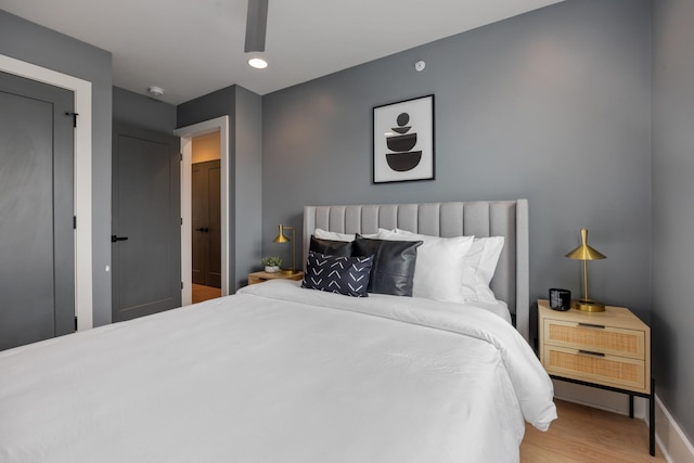 bedroom with wood-type flooring