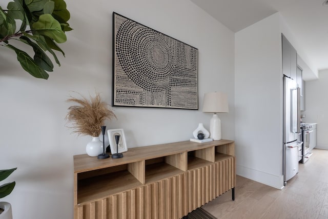 interior details with hardwood / wood-style flooring and appliances with stainless steel finishes