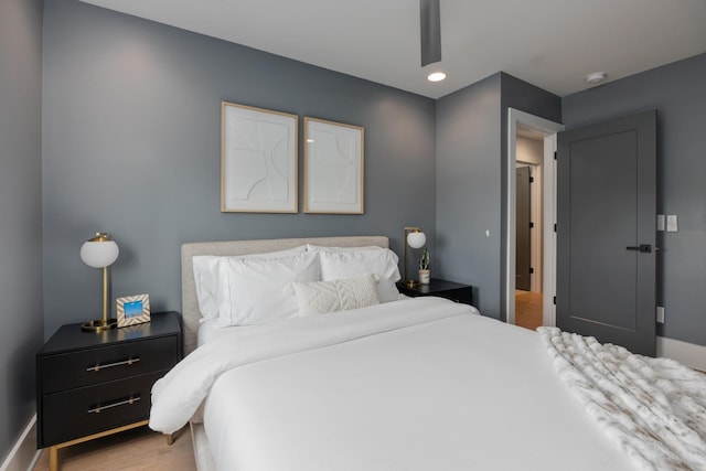 bedroom featuring ceiling fan and wood-type flooring