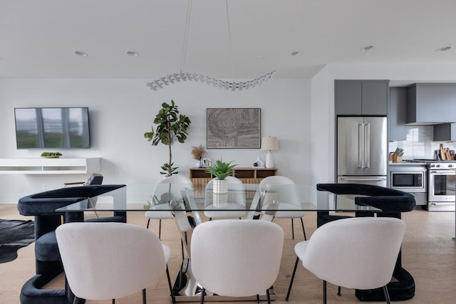 dining space featuring light hardwood / wood-style floors