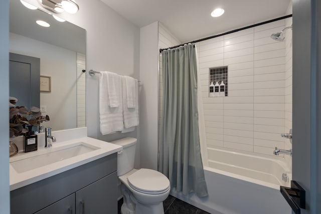 full bathroom featuring tile patterned flooring, vanity, shower / bath combo, and toilet