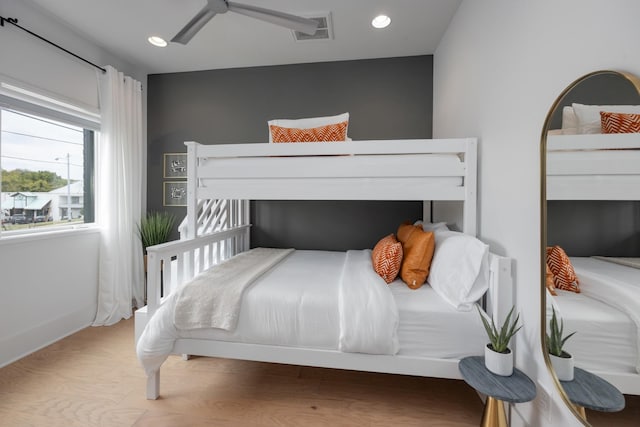 bedroom with hardwood / wood-style flooring and ceiling fan