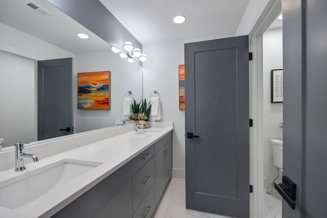 bathroom with vanity and toilet