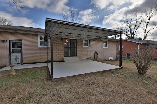 rear view of property featuring a yard