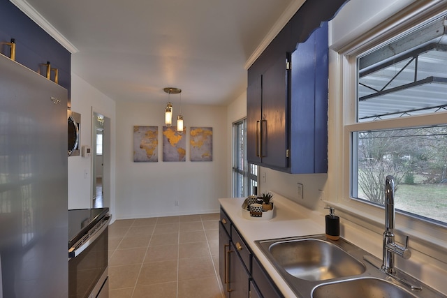 kitchen featuring stainless steel appliances, crown molding, sink, light tile patterned floors, and decorative light fixtures