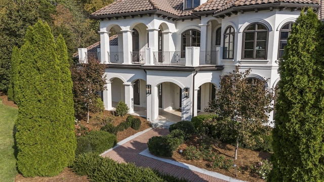 mediterranean / spanish-style home with a balcony