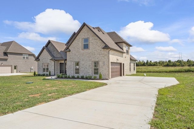 french country style house featuring a front yard and a garage