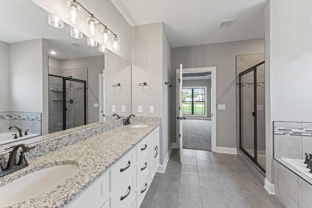 bathroom featuring tile patterned floors, vanity, and plus walk in shower