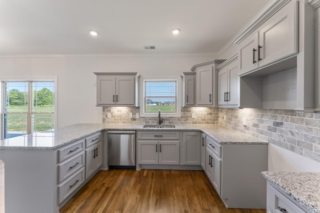 kitchen with dishwasher, sink, tasteful backsplash, light stone counters, and kitchen peninsula