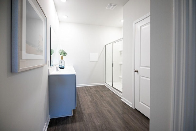 hallway featuring dark hardwood / wood-style flooring