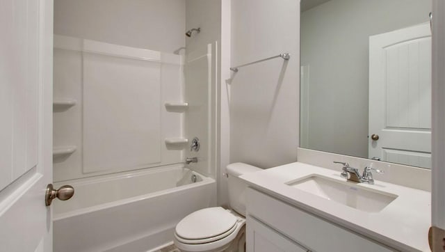 full bathroom featuring washtub / shower combination, vanity, and toilet