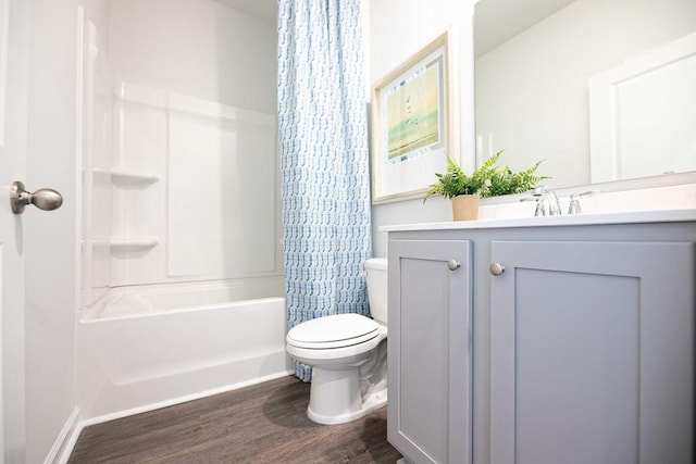 full bathroom featuring vanity, wood-type flooring, shower / bath combo, and toilet