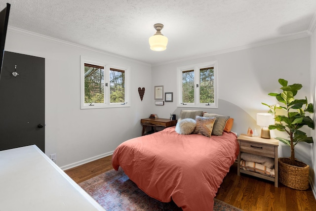 bedroom featuring multiple windows, dark wood-type flooring, and a textured ceiling