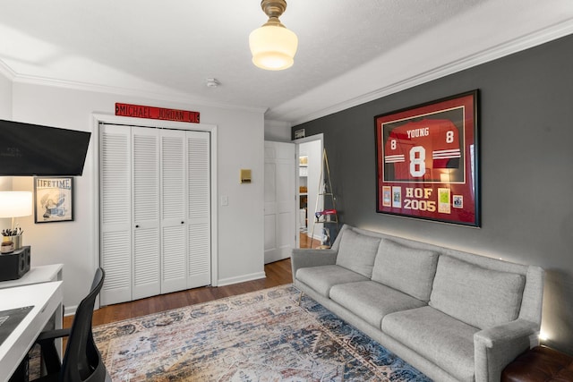 office featuring dark hardwood / wood-style floors, ornamental molding, and a textured ceiling